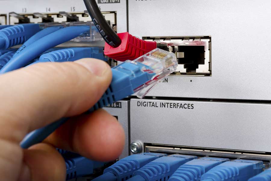Closeup Engineer connecting telcom cables